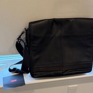 Tumi Black Leather Messenger Bag with Adjustable Strap